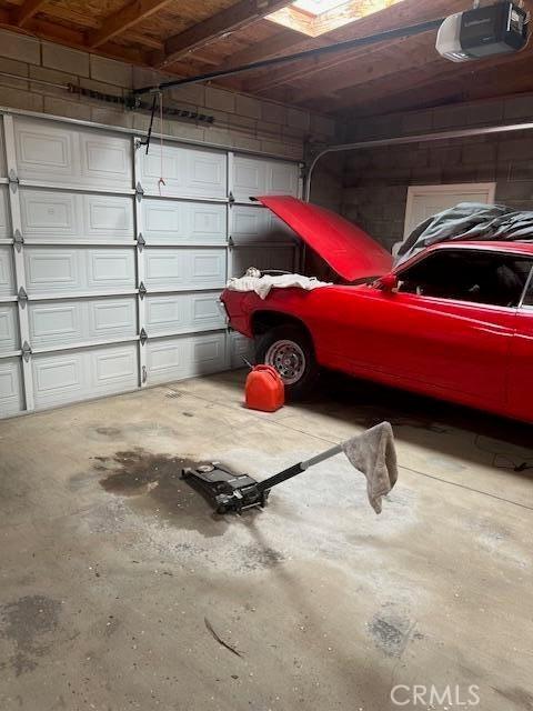 38833 Sage Tree St, Palmdale, CA 93551 - garage featuring a garage door opener