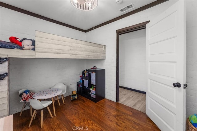 4674 Norton Pl, Riverside, CA 92506 - bedroom with wood finished floors, crown molding, and concrete block wall