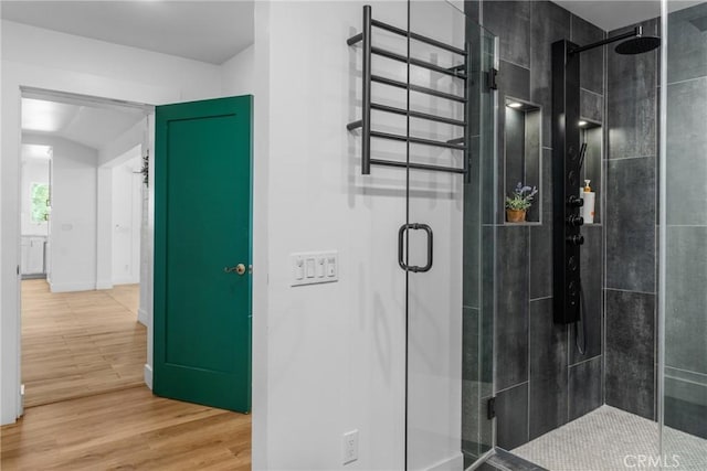 4674 Norton Pl, Riverside, CA 92506 - bathroom featuring a stall shower and wood finished floors