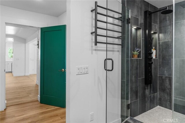 4674 Norton Pl, Riverside, CA 92506 - bathroom featuring a shower stall and wood finished floors