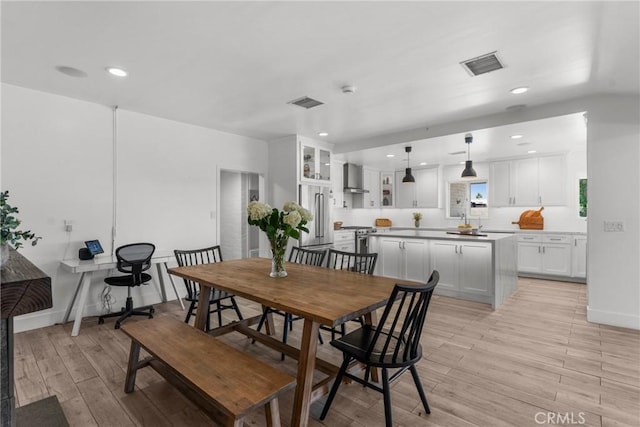 4674 Norton Pl, Riverside, CA 92506 - dining space featuring light wood finished floors, recessed lighting, and baseboards