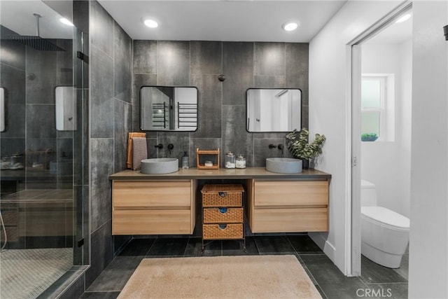 4674 Norton Pl, Riverside, CA 92506 - bathroom featuring a shower stall, vanity, toilet, tile walls, and recessed lighting