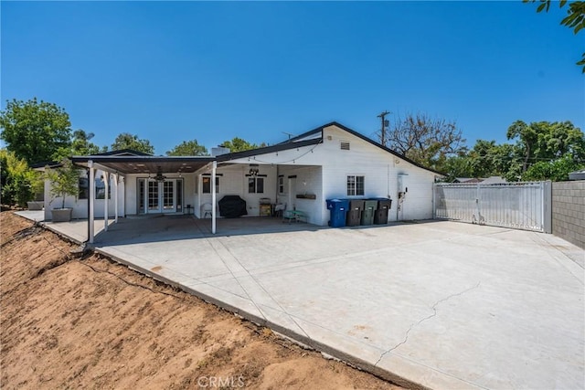 4674 Norton Pl, Riverside, CA 92506 - back of property with french doors, ceiling fan, a gate, and a patio