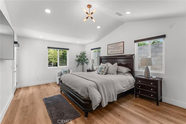 4674 Norton Pl, Riverside, CA 92506 - bedroom featuring vaulted ceiling, light wood-style flooring, baseboards, recessed lighting, and a chandelier