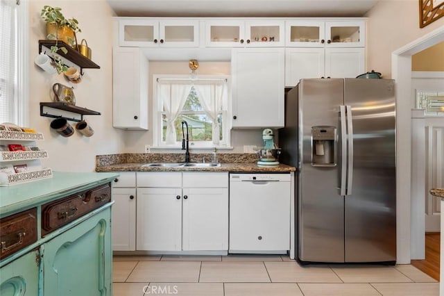 967 W 2nd Ave, Escondido, CA 92025 - kitchen with stainless steel fridge, white dishwasher, a sink, open shelves, and white cabinets