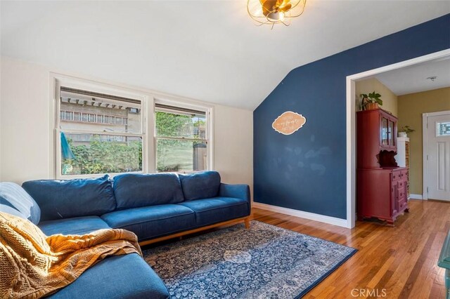 967 W 2nd Ave, Escondido, CA 92025 - living area featuring vaulted ceiling, wood finished floors, and baseboards