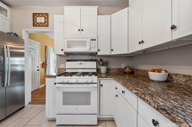 967 W 2nd Ave, Escondido, CA 92025 - kitchen with white appliances, white cabinets, and dark stone countertops