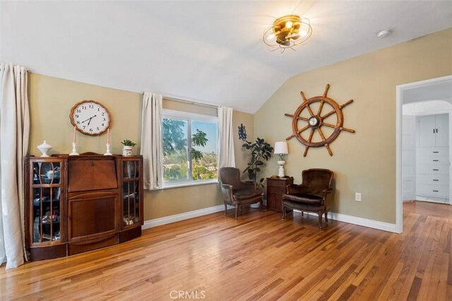967 W 2nd Ave, Escondido, CA 92025 - sitting room with baseboards, wood finished floors, and lofted ceiling