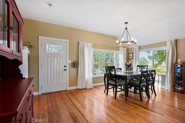 967 W 2nd Ave, Escondido, CA 92025 - dining space with a chandelier, light wood-style flooring, and baseboards