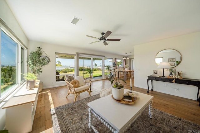 3890 Vista Campana S Unit 35, Oceanside, CA 92057 - living room with healthy amount of natural light, ceiling fan, and hardwood / wood-style flooring