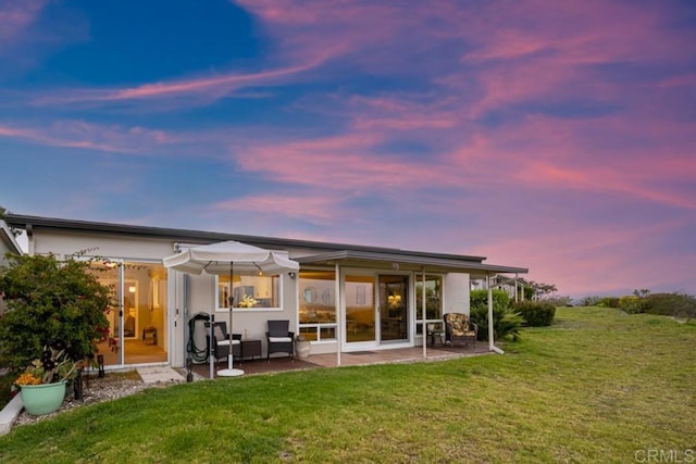 3890 Vista Campana S Unit 35, Oceanside, CA 92057 - back of house featuring a yard and a patio area