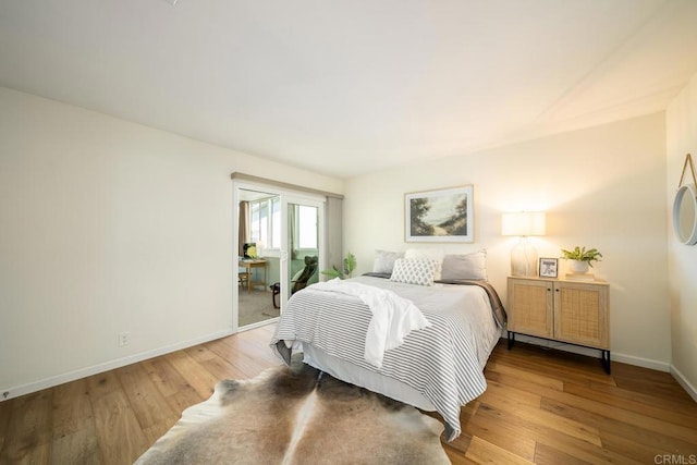 3890 Vista Campana S Unit 35, Oceanside, CA 92057 - bedroom with baseboards and wood finished floors