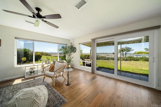 3890 Vista Campana S Unit 35, Oceanside, CA 92057 - sunroom / solarium featuring baseboards and wood finished floors