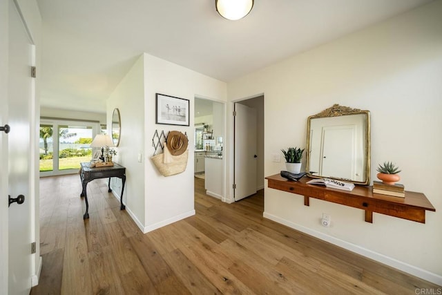 3890 Vista Campana S Unit 35, Oceanside, CA 92057 - hallway featuring baseboards and wood finished floors