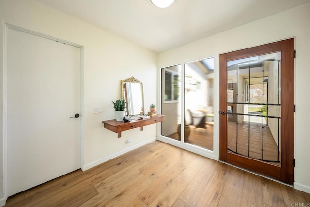 3890 Vista Campana S Unit 35, Oceanside, CA 92057 - doorway with light wood-style floors and baseboards