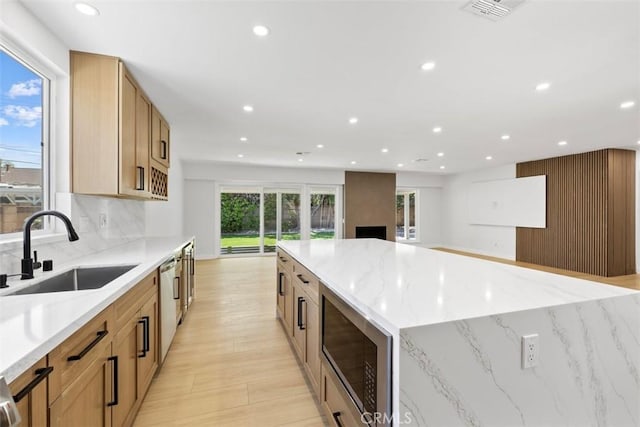 22306 Marlin Pl, Canoga Park, CA 91303 - kitchen with a sink, appliances with stainless steel finishes, recessed lighting, light stone counters, and open floor plan