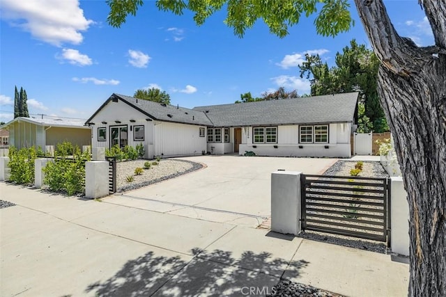 22306 Marlin Pl, Canoga Park, CA 91303 - view of front of property with a fenced front yard, a gate, and concrete driveway