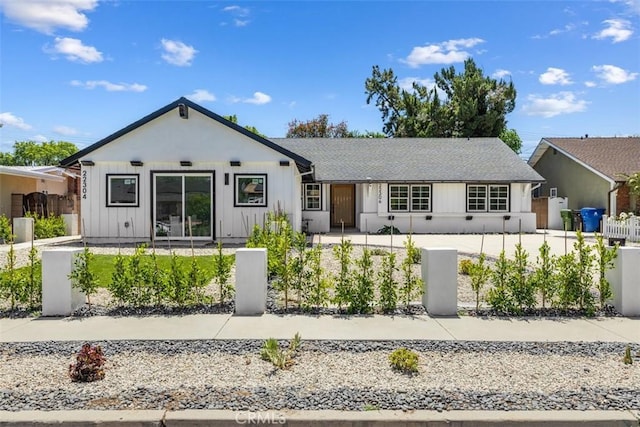 22306 Marlin Pl, Canoga Park, CA 91303 - view of front of property featuring a fenced front yard and board and batten siding