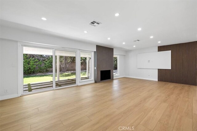 22306 Marlin Pl, Canoga Park, CA 91303 - unfurnished living room featuring recessed lighting, light wood-style floors, and baseboards