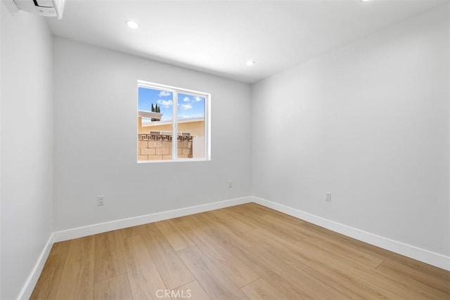 22306 Marlin Pl, Canoga Park, CA 91303 - spare room with light wood finished floors, baseboards, recessed lighting, and a wall mounted AC