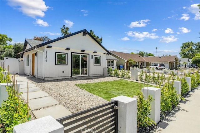 22306 Marlin Pl, Canoga Park, CA 91303 - back of property with a gate and board and batten siding