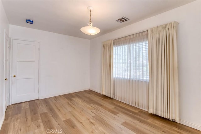 2107 Cyril Ave, Los Angeles, CA 90032 - empty room with light wood-style flooring and baseboards