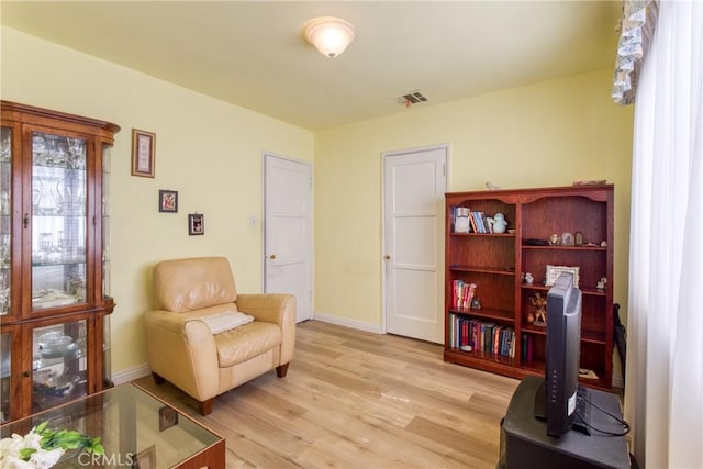 2107 Cyril Ave, Los Angeles, CA 90032 - living area with light wood finished floors and baseboards