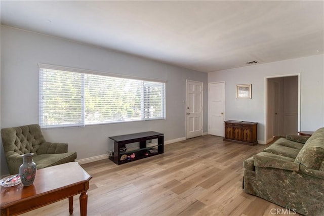 2107 Cyril Ave, Los Angeles, CA 90032 - living area featuring light wood-style flooring and baseboards