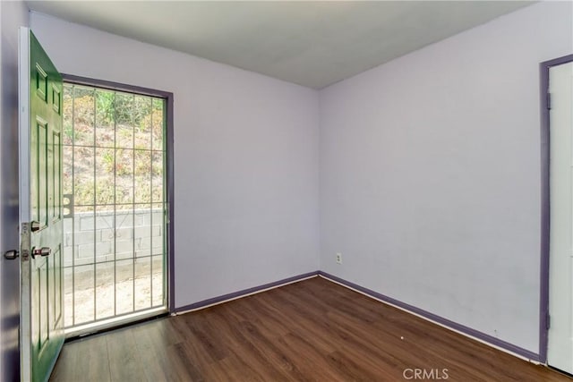 2107 Cyril Ave, Los Angeles, CA 90032 - spare room with wood finished floors and baseboards
