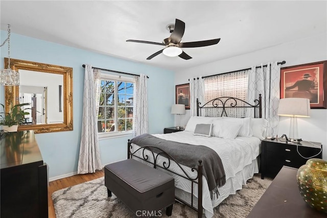 11900 Covello St, North Hollywood, CA 91605 - bedroom with wood finished floors, ceiling fan, and baseboards