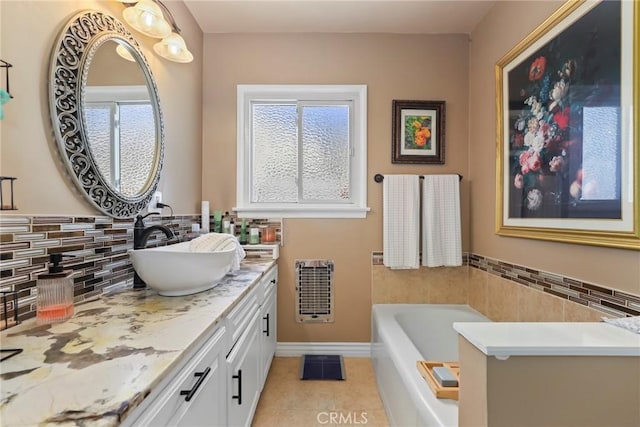 11900 Covello St, North Hollywood, CA 91605 - bathroom with heating unit, tile patterned flooring, vanity, a bath, and plenty of natural light
