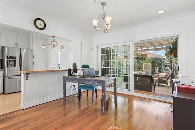 11900 Covello St, North Hollywood, CA 91605 - dining space featuring a chandelier, a desk, ornamental molding, and light wood finished floors