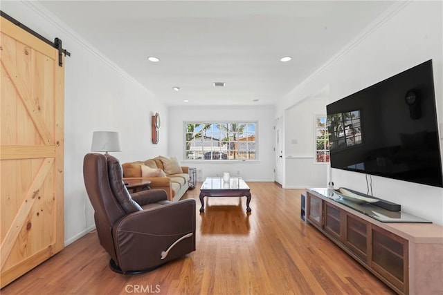 11900 Covello St, North Hollywood, CA 91605 - living area with light wood-style flooring, ornamental molding, a barn door, baseboards, and recessed lighting