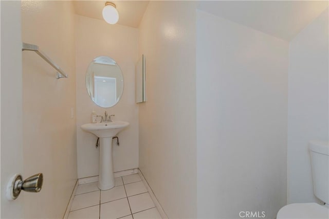 5021 Peck Rd Unit 9, El Monte, CA 91732 - bathroom featuring toilet, tile patterned floors, and baseboards