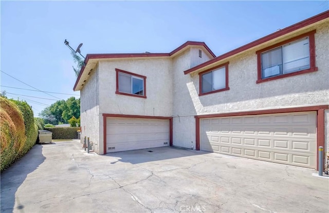 5021 Peck Rd Unit 9, El Monte, CA 91732 - townhome / multi-family property featuring stucco siding, an attached garage, and concrete driveway