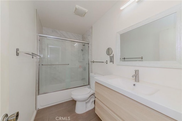 5021 Peck Rd Unit 9, El Monte, CA 91732 - bathroom featuring toilet, vanity, and enclosed tub / shower combo
