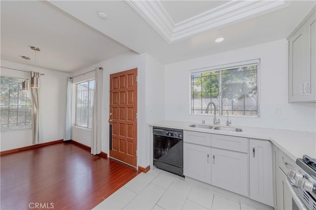 5021 Peck Rd Unit 9, El Monte, CA 91732 - kitchen featuring dishwasher, a sink, crown molding, light countertops, and decorative light fixtures