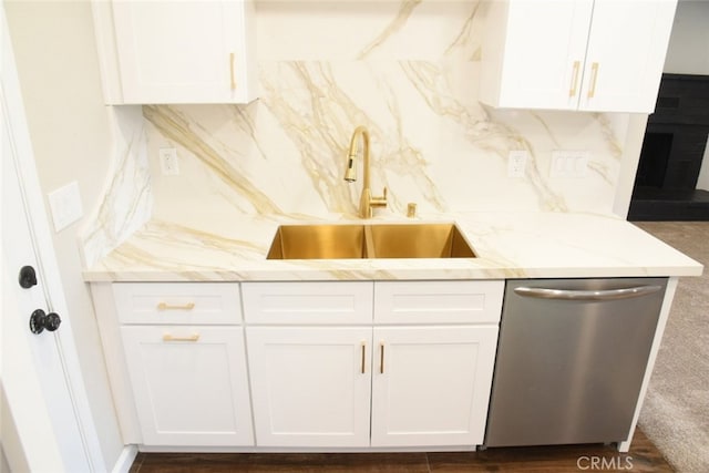 983 Venus Way, Crestline, CA 92325 - kitchen featuring dishwasher, a sink, white cabinetry, and tasteful backsplash