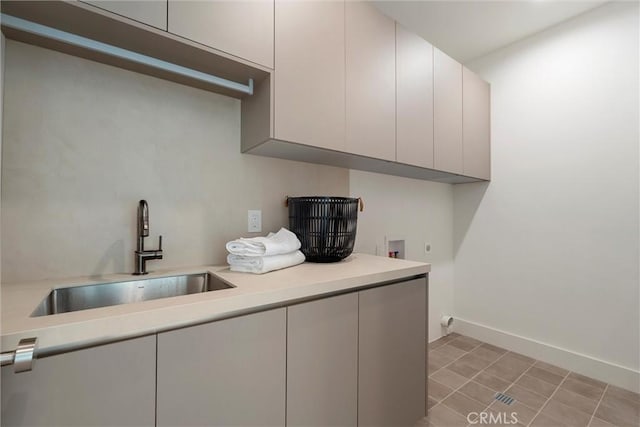 4625 Vesper Ave, Sherman Oaks, CA 91403 - kitchen with a sink, light countertops, baseboards, and modern cabinets