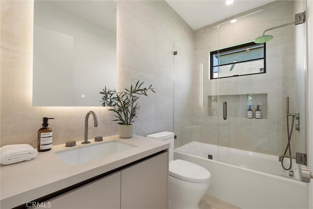 4625 Vesper Ave, Sherman Oaks, CA 91403 - full bath featuring tile walls, toilet, shower / bath combination with glass door, and vanity