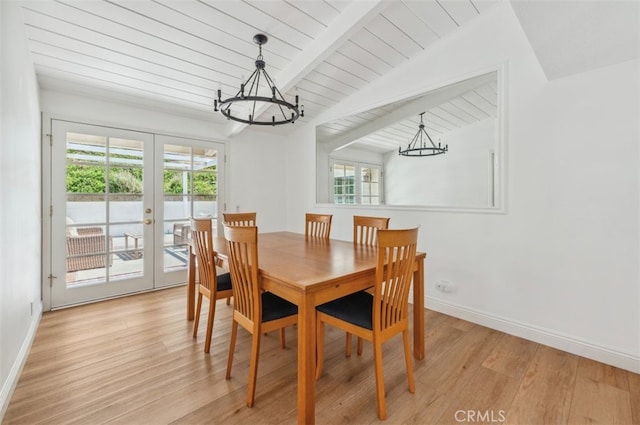 4950 Dunman Ave, Woodland Hills, CA 91364 - dining area featuring a chandelier, french doors, plenty of natural light, light wood finished floors, and wood ceiling with exposed beams
