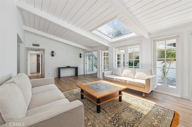 4950 Dunman Ave, Woodland Hills, CA 91364 - living room featuring a skylight, wood finished floors, wood ceiling, and french doors