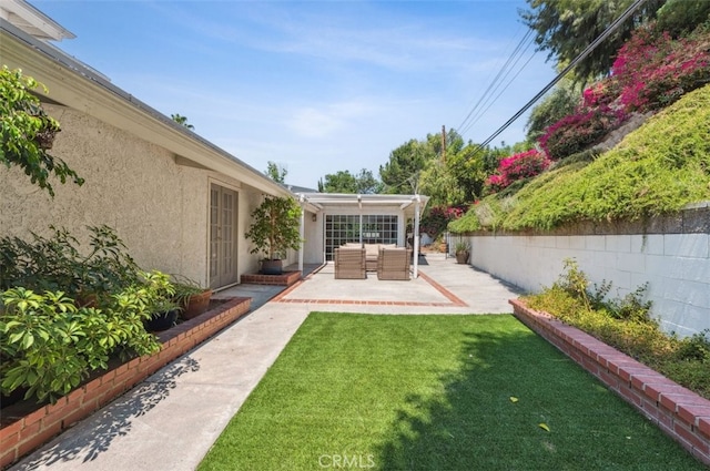 4950 Dunman Ave, Woodland Hills, CA 91364 - view of grassy yard with outdoor lounge area and a patio