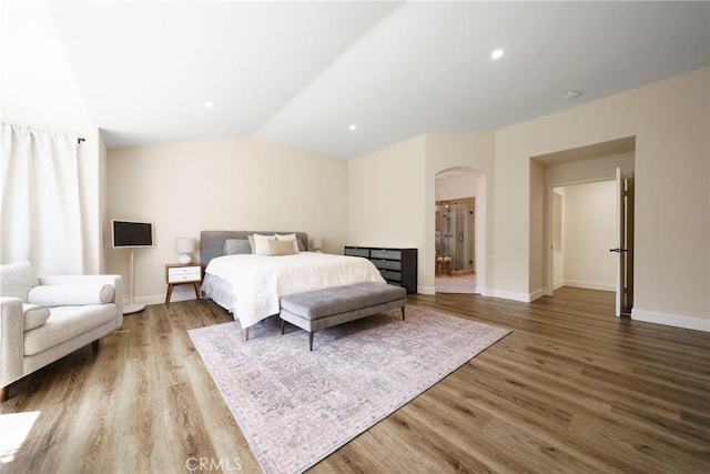 2902 Easton Pl, Rowland Heights, CA 91748 - bedroom featuring arched walkways, wood finished floors, baseboards, and vaulted ceiling