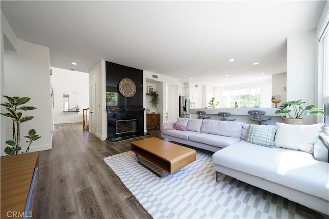 2902 Easton Pl, Rowland Heights, CA 91748 - living room featuring wood finished floors, recessed lighting, and a glass covered fireplace