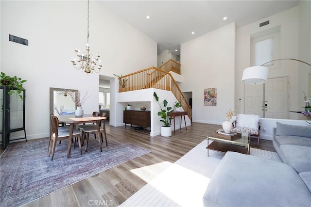 2902 Easton Pl, Rowland Heights, CA 91748 - living area with a high ceiling, stairway, a chandelier, wood finished floors, and baseboards