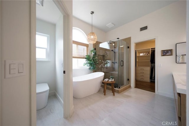 2902 Easton Pl, Rowland Heights, CA 91748 - bathroom featuring vanity, a shower stall, a freestanding tub, a spacious closet, and toilet