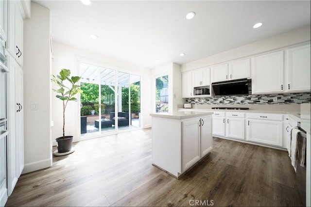 2902 Easton Pl, Rowland Heights, CA 91748 - kitchen featuring dark wood-type flooring, backsplash, a center island, and recessed lighting