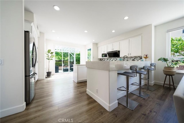 2902 Easton Pl, Rowland Heights, CA 91748 - kitchen featuring freestanding refrigerator, plenty of natural light, white cabinetry, and recessed lighting