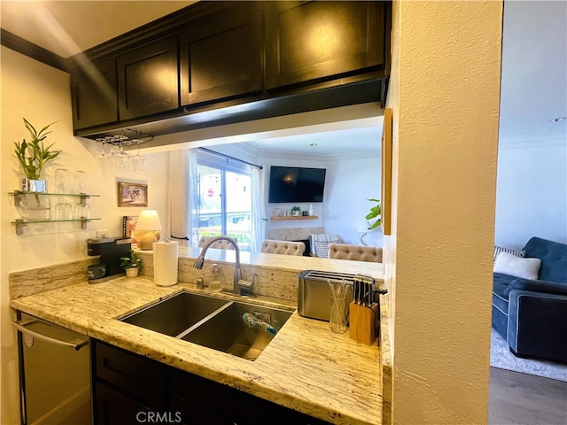 10960 Ashton Ave Unit 307, Los Angeles, CA 90024 - kitchen with light stone countertops, stainless steel dishwasher, ornamental molding, and open floor plan